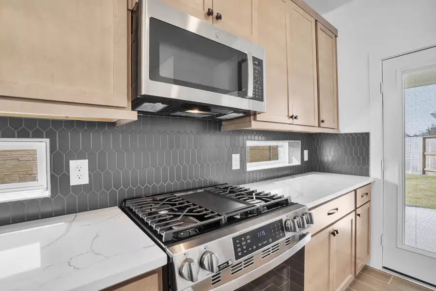 Furnished interior view inside a new home in Meridiana, Manvel (Image 7).