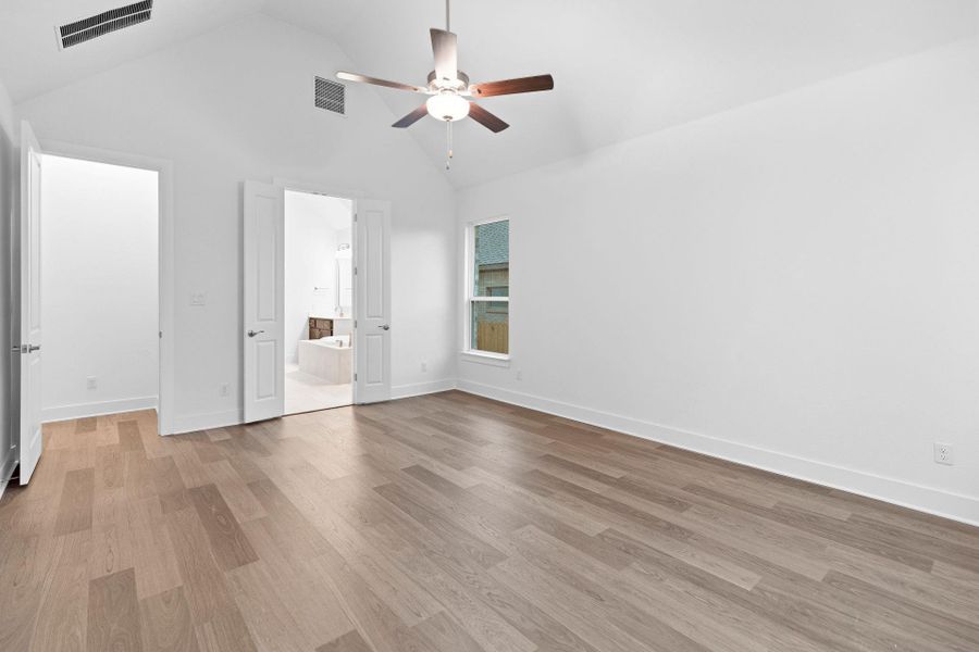 Primary Bedroom with elevated ceiling