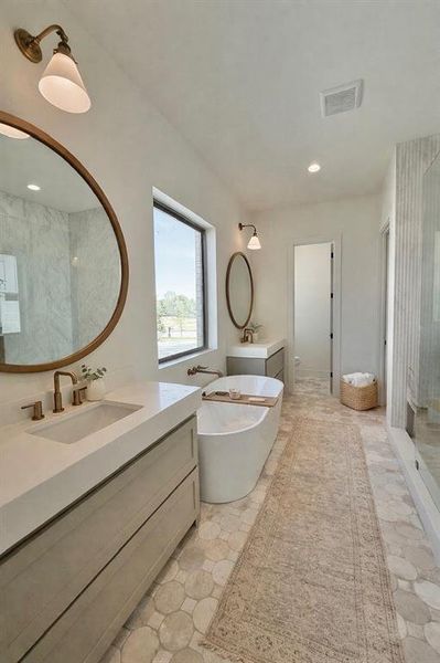 Two Vanities, decorative lighting and mirrors, soaking tub