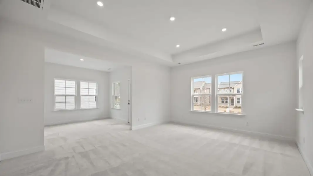 The Brentwood Plan by DRB Homes in River District, Charlotte NC.- Primary Bedroom with Sitting Area