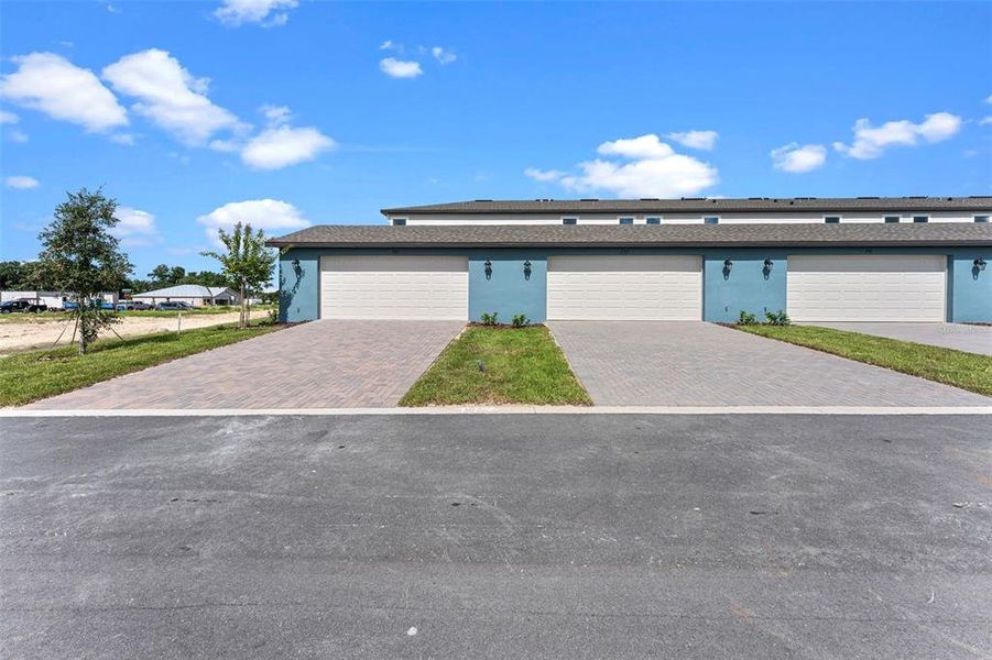Front exterior of a new home in Eden Crest, Apopka, FL, highlighting curb appeal (Image 22). Front exterior of a new home in Eden Crest, Apopka, FL, highlighting curb appeal (Image 22).