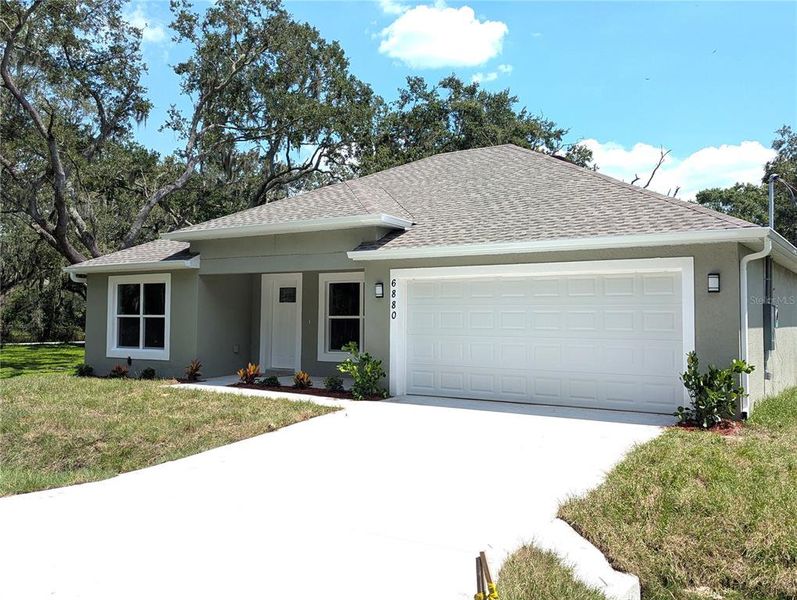 Front exterior of a new home in , Mulberry, FL, highlighting curb appeal (Image 2).