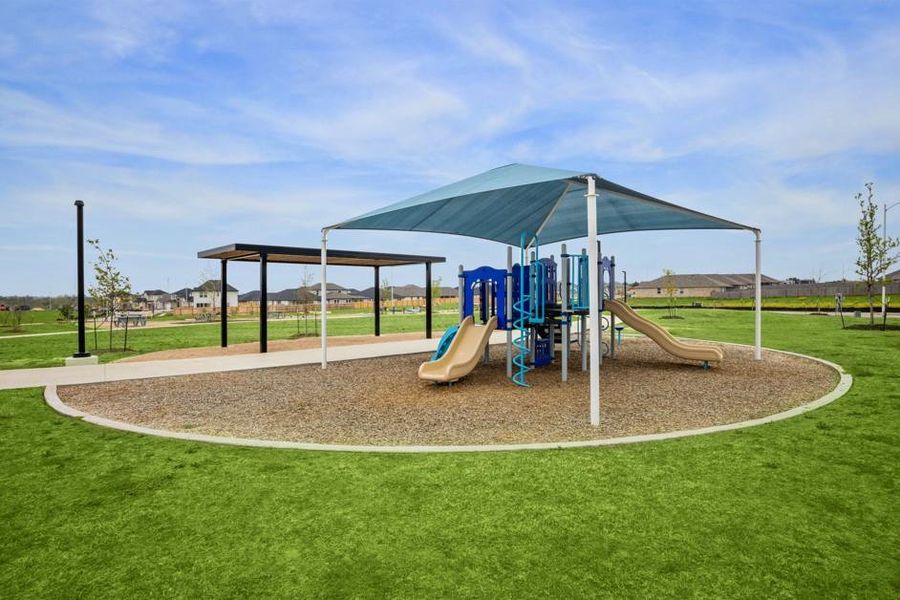 Community playground featuring a lawn