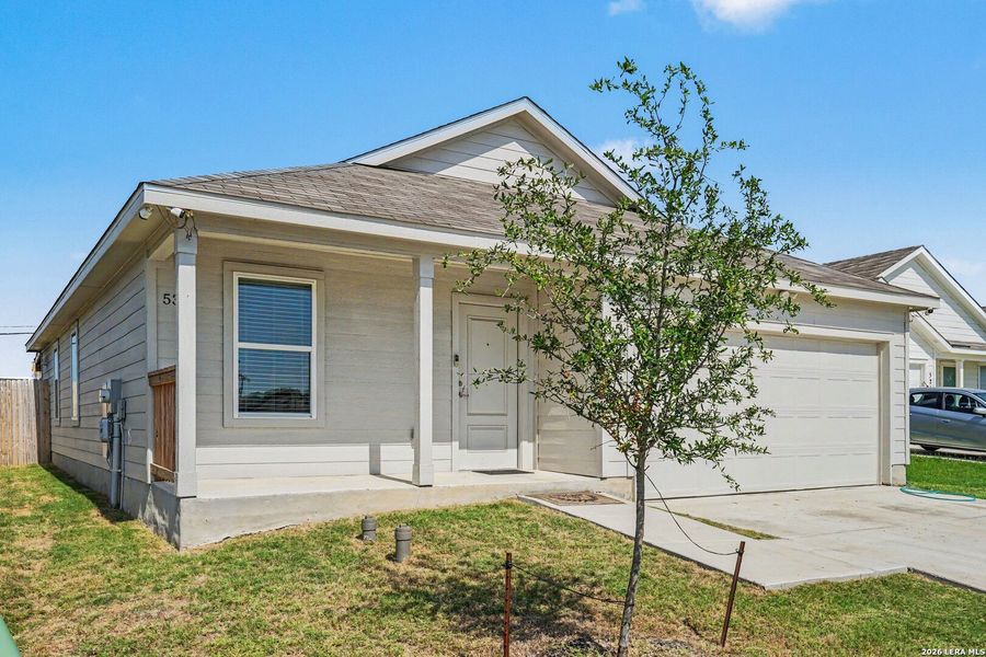Front exterior of a new home in Tarasco Gardens, San Antonio, TX, highlighting curb appeal (Image 2). Front exterior of a new home in Tarasco Gardens, San Antonio, TX, highlighting curb appeal (Image 2).