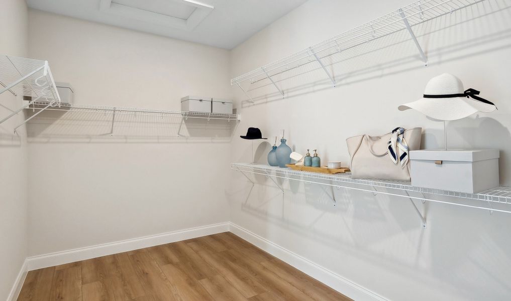 Spacious walk-in closet in primary suite