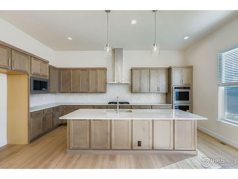 Furnished interior view inside a new home in RainDance, Windsor (Image 7).