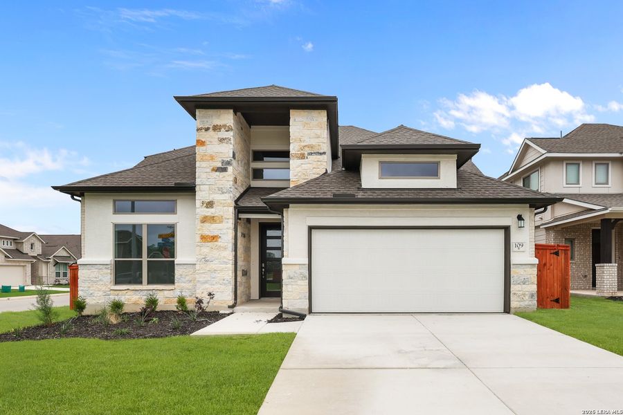 Front exterior of a new home in Megan's Landing, Castroville, TX, highlighting curb appeal (Image 29).