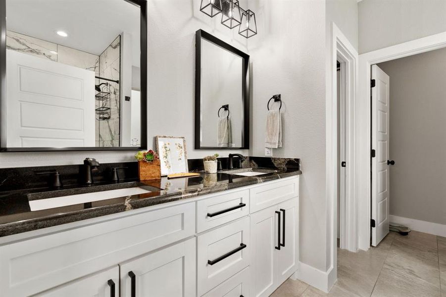 En-Suite bathroom with marble counters and dual sinks.