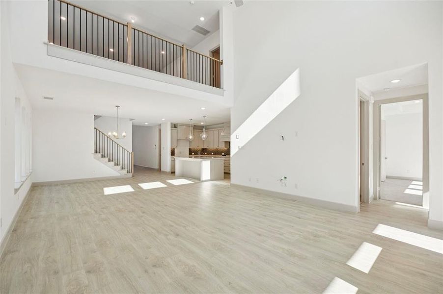 With the family room open to the game room above, you'll enjoy multi-level entertainment zones in this dream home!