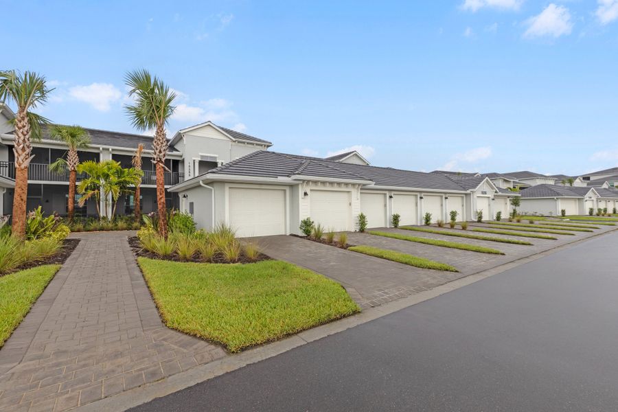 Front exterior of a new home in Webbs Reserve at Babcock Ranch, Punta Gorda, FL, highlighting curb appeal (Image 1). Front exterior of a new home in Webbs Reserve at Babcock Ranch, Punta Gorda, FL, highlighting curb appeal (Image 1).