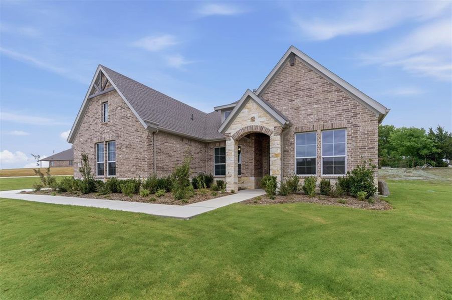 Front exterior of a new home in Grayson Ridge, Van Alstyne, TX, highlighting curb appeal (Image 20).
