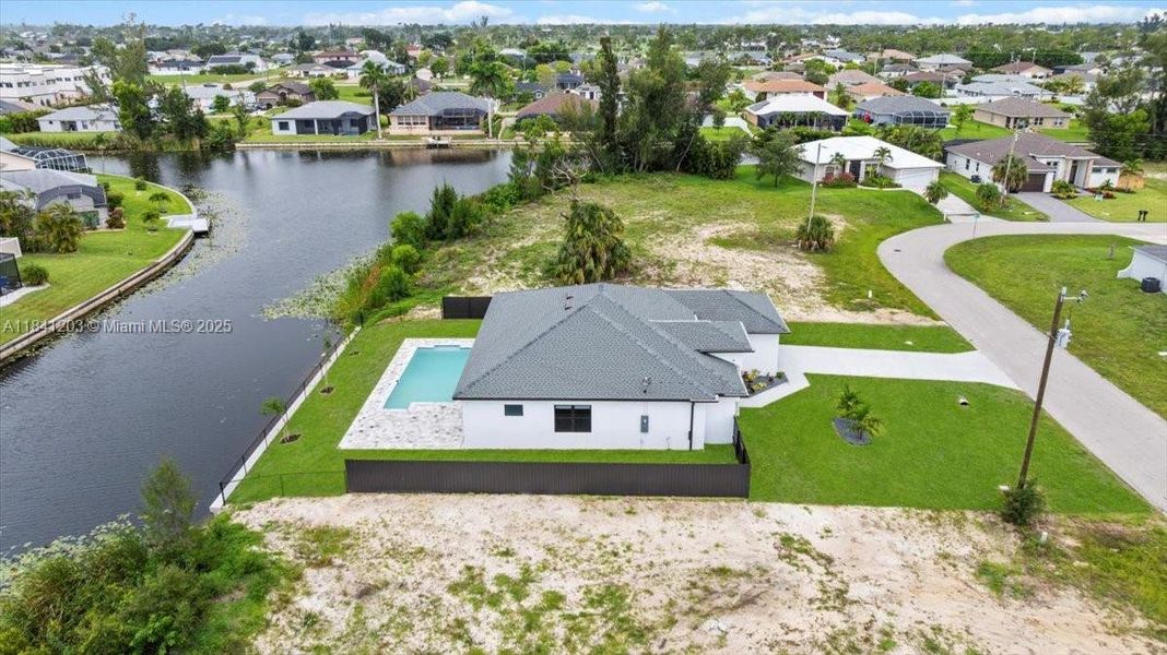 Front exterior of a new home in , Cape Coral, FL, highlighting curb appeal (Image 26). Front exterior of a new home in , Cape Coral, FL, highlighting curb appeal (Image 26).
