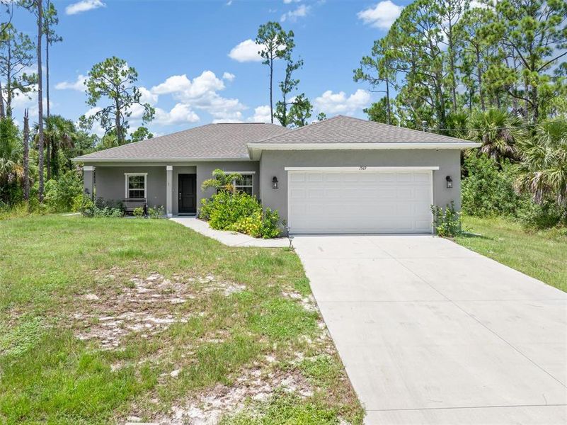 Front exterior of a new home in , North Port, FL, highlighting curb appeal (Image 19).