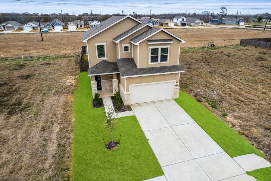 Front exterior of a new home in Glendale Lakes, Rosharon, TX, highlighting curb appeal (Image 31). Front exterior of a new home in Glendale Lakes, Rosharon, TX, highlighting curb appeal (Image 31).