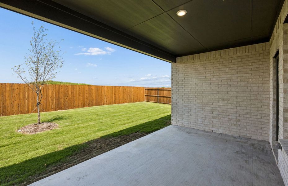 Exterior details and patio area of a home in Whitewing Trails, Princeton (Image 3).