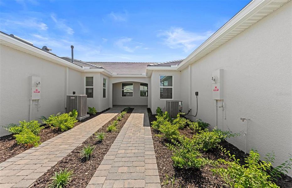 Exterior details and patio area of a home in BeachWalk by Manasota Key, Englewood (Image 17). Exterior details and patio area of a home in BeachWalk by Manasota Key, Englewood (Image 17).
