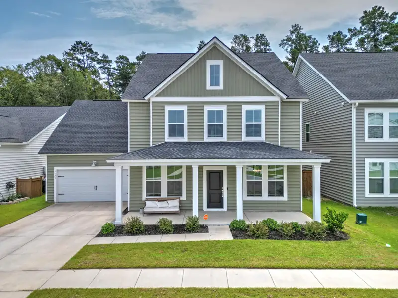 Front exterior of a new home in Sweetgrass at Summers Corner, Summerville, SC, highlighting curb appeal (Image 28). Front exterior of a new home in Sweetgrass at Summers Corner, Summerville, SC, highlighting curb appeal (Image 28).