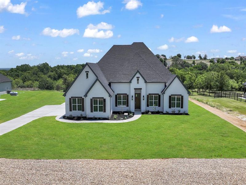 Front exterior of a new home in , Fort Worth, TX, highlighting curb appeal (Image 23). Front exterior of a new home in , Fort Worth, TX, highlighting curb appeal (Image 23).