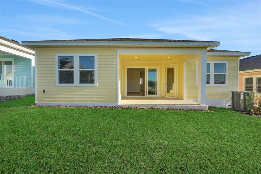 Exterior details and patio area of a home in Green Key Village, Lady Lake (Image 22).