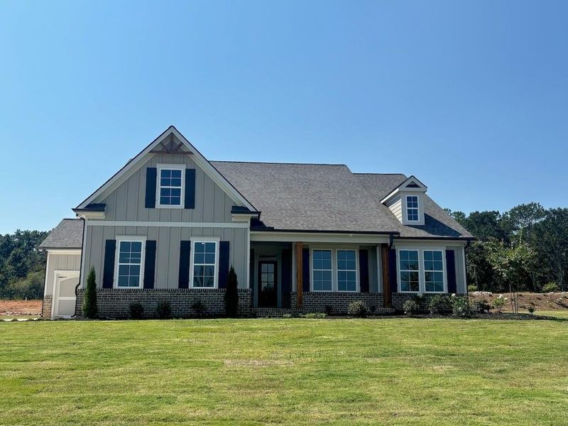 Front exterior of a new home in Pinegate, Covington, GA, highlighting curb appeal (Image 1). Front exterior of a new home in Pinegate, Covington, GA, highlighting curb appeal (Image 1).