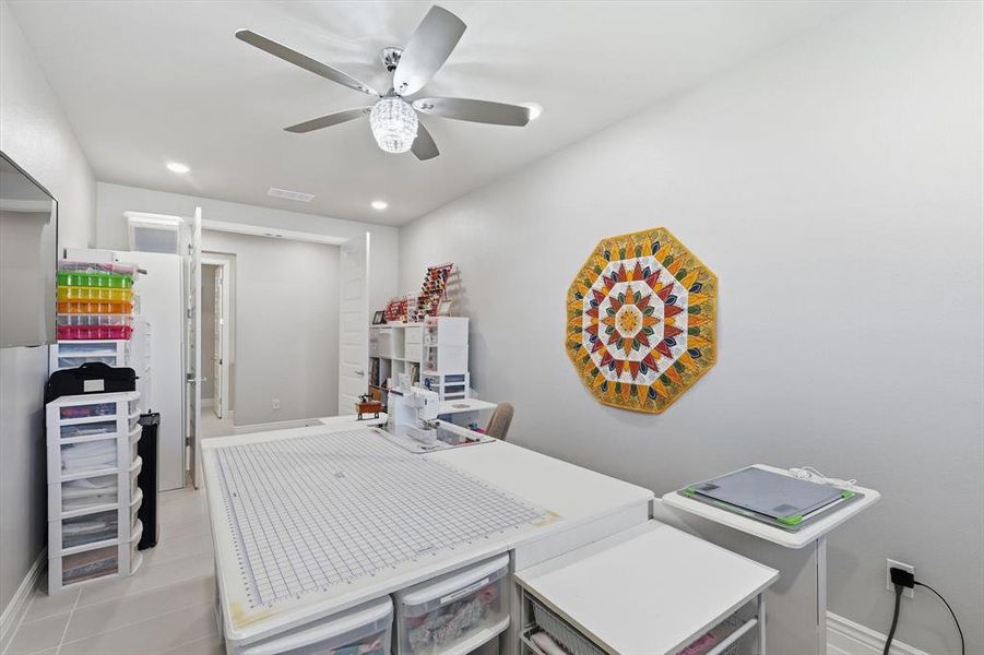 Interior room featuring light gray walls and tile flooring