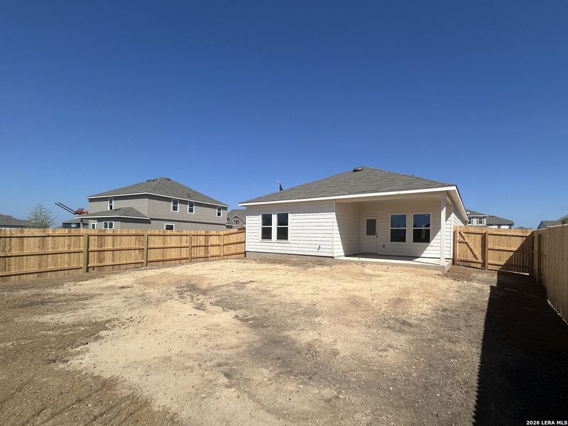 Exterior details and patio area of a home in Hennersby Hollow, San Antonio (Image 18).