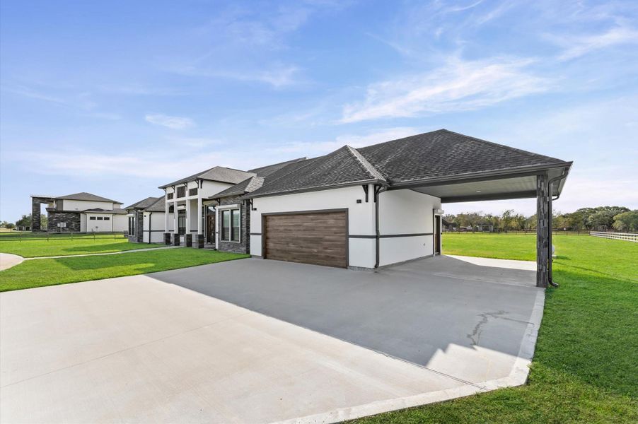 Front exterior of a new home in , Rosharon, TX, highlighting curb appeal (Image 2).