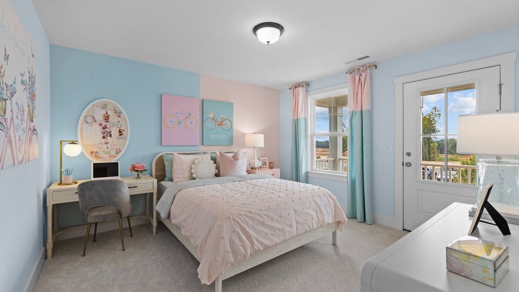 Spacious secondary bedroom with large windows in the Jordan Design by DRB Homes in York, SC