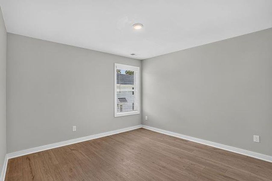 Spacious, unfurnished interior of a new home in The Cottages at East Lanier, Fayetteville (Image 15).