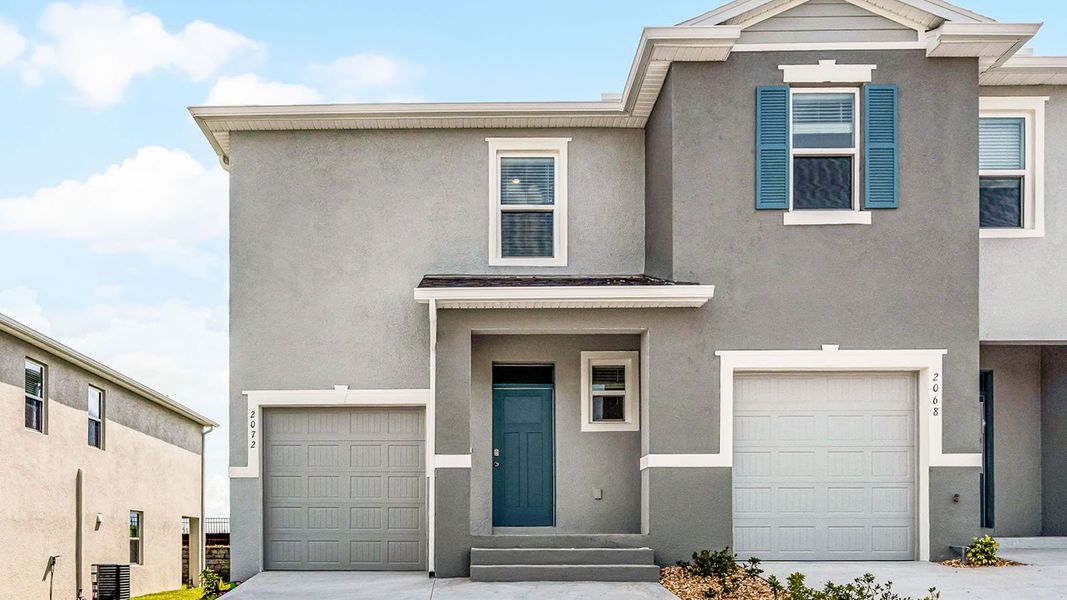 Front exterior of a new home in Brentwood, Davenport, FL, highlighting curb appeal (Image 1). Front exterior of a new home in Brentwood, Davenport, FL, highlighting curb appeal (Image 1).
