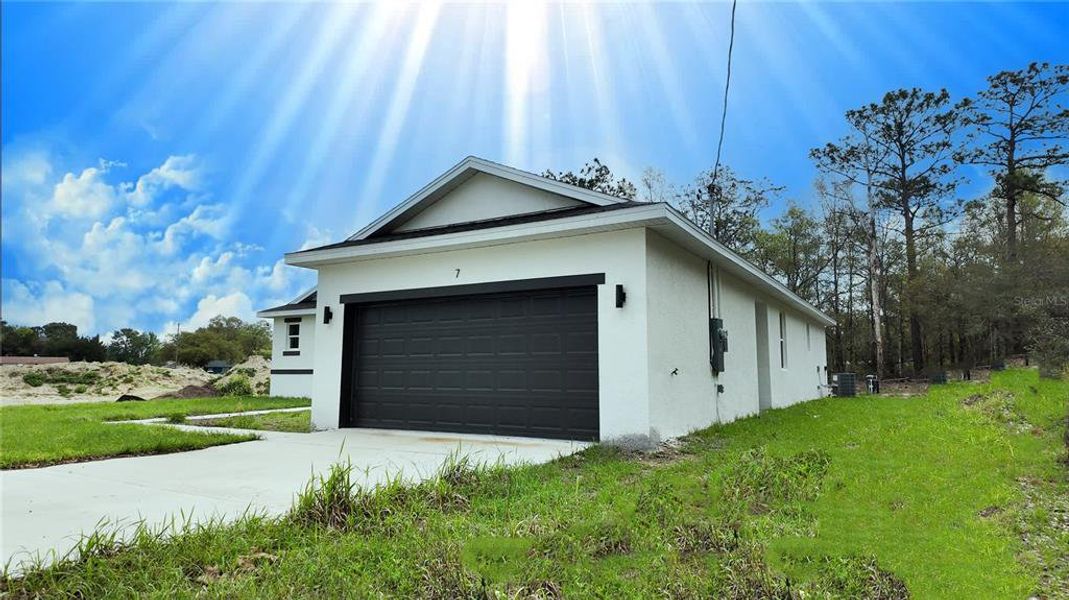 Front exterior of a new home in , Ocala, FL, highlighting curb appeal (Image 20). Front exterior of a new home in , Ocala, FL, highlighting curb appeal (Image 20).