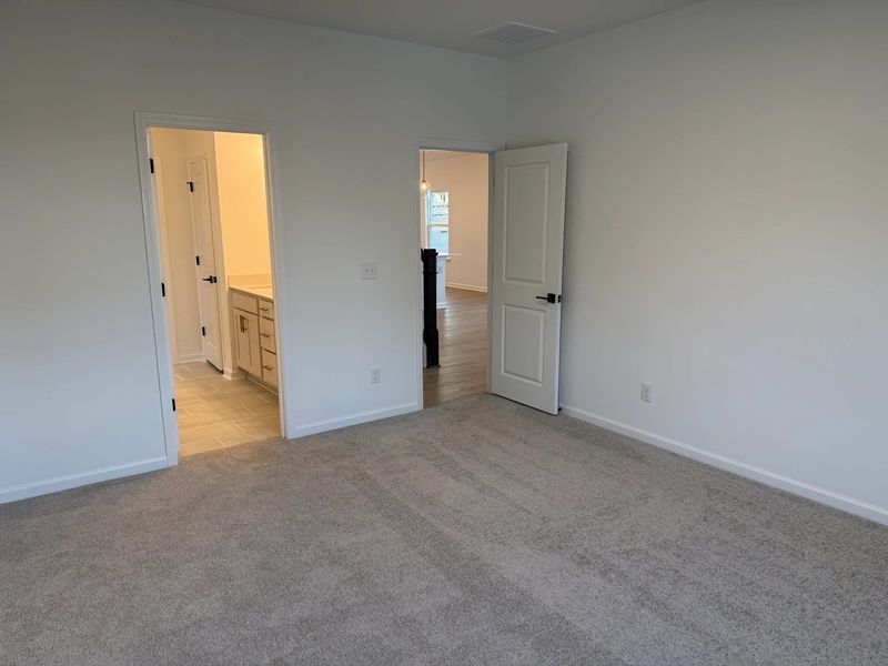 Primary Bed featuring the AW Collection® Serene - A tranquil retreat in soft, neutral textures. Primary Bed featuring the AW Collection® Serene - A tranquil retreat in soft, neutral textures.