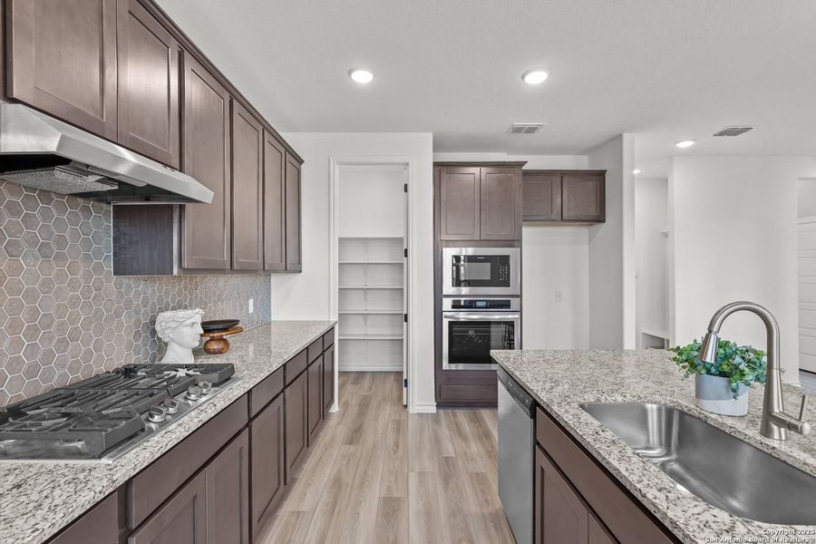 Furnished interior view inside a new home in Ladera, San Antonio (Image 19).