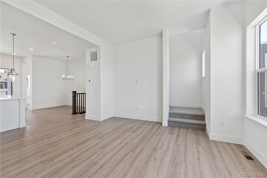 Great room opens to kitchen and dining room