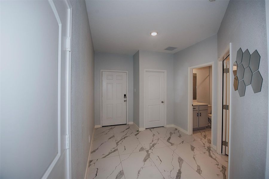 Stunning foyer with soft color and gorgeous porcelain tiled floors with marble appearance. Stunning foyer with soft color and gorgeous porcelain tiled floors with marble appearance.