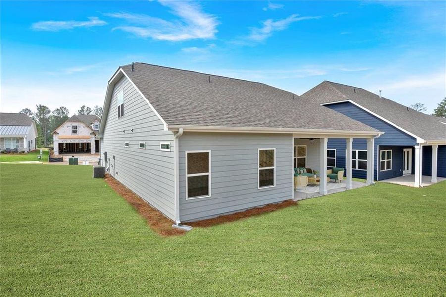 Exterior details and patio area of a home in Heritage Pointe at The Georgian, Villa Rica (Image 3).