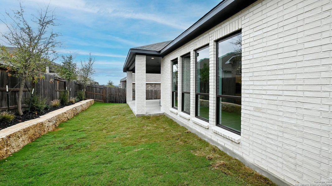Exterior details and patio area of a home in Veramendi 60', New Braunfels (Image 20).