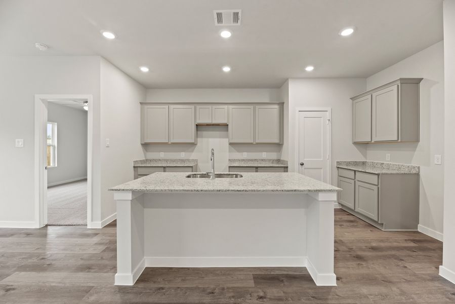 A kitchen with white cabinets. A kitchen with white cabinets.
