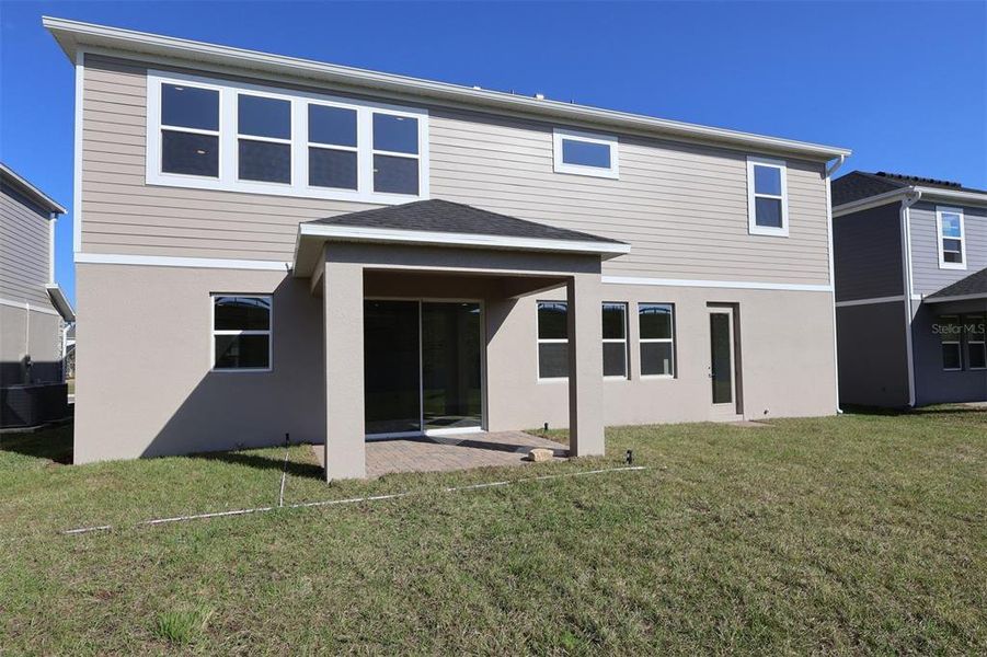 Exterior details and patio area of a home in Emerson Pointe, Apopka (Image 3).