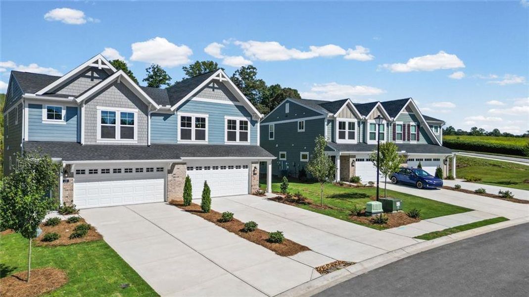 Front exterior of a new home in Villas at Gold Creek, Dawsonville, GA, highlighting curb appeal (Image 2). Front exterior of a new home in Villas at Gold Creek, Dawsonville, GA, highlighting curb appeal (Image 2).
