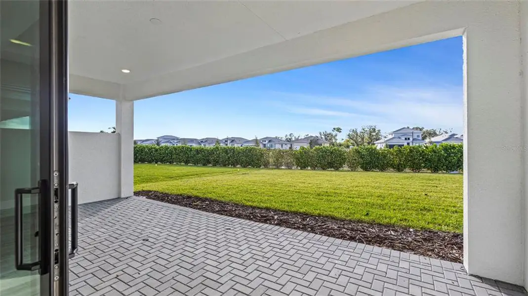 Exterior details and patio area of a home in Cresswind Lakewood Ranch, Lakewood Ranch (Image 3).