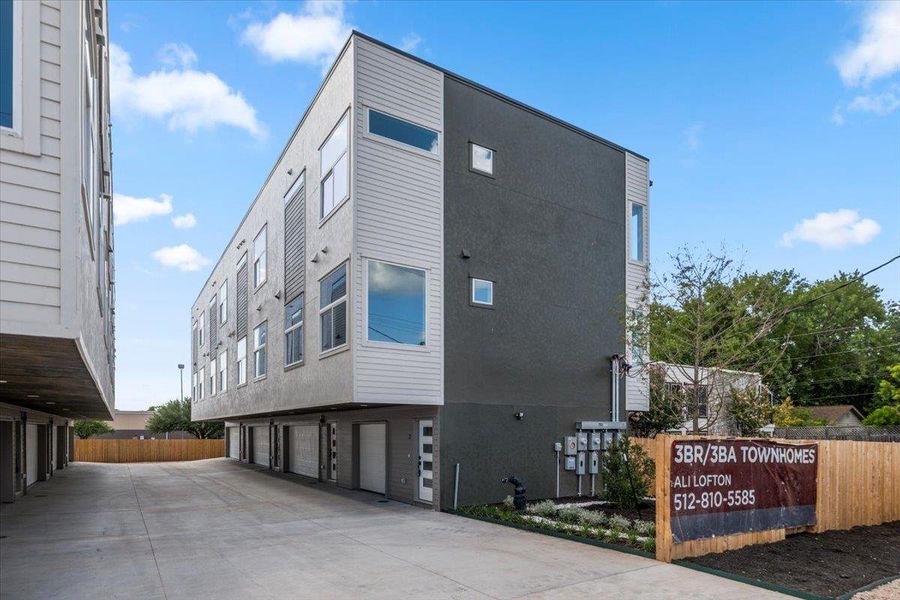 Modern townhomes offer convenient street-level garage parking and contemporary exterior finishes.