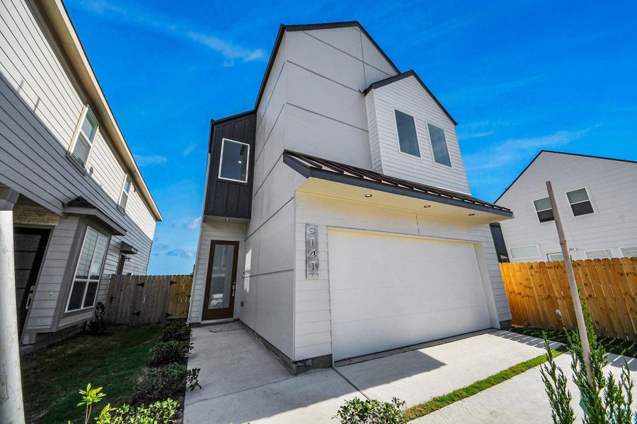 Front exterior of a new home in , Houston, TX, highlighting curb appeal (Image 20).