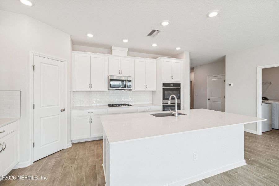 Furnished interior view inside a new home in Tributary 50', Yulee (Image 8).