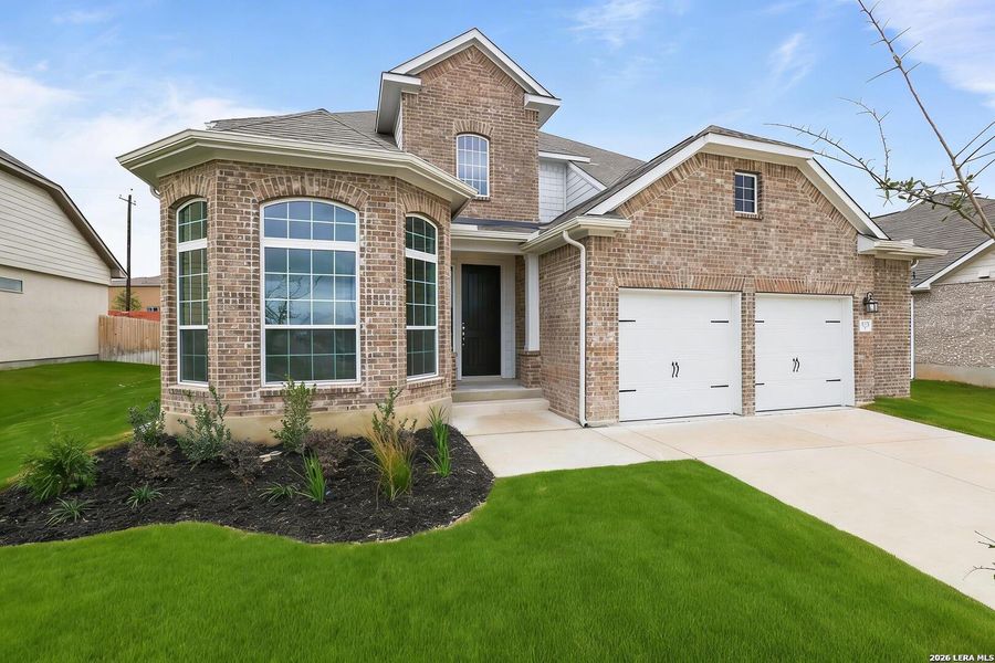 Front exterior of a new home in Buffalo Crossing, Cibolo, TX, highlighting curb appeal (Image 1). Front exterior of a new home in Buffalo Crossing, Cibolo, TX, highlighting curb appeal (Image 1).