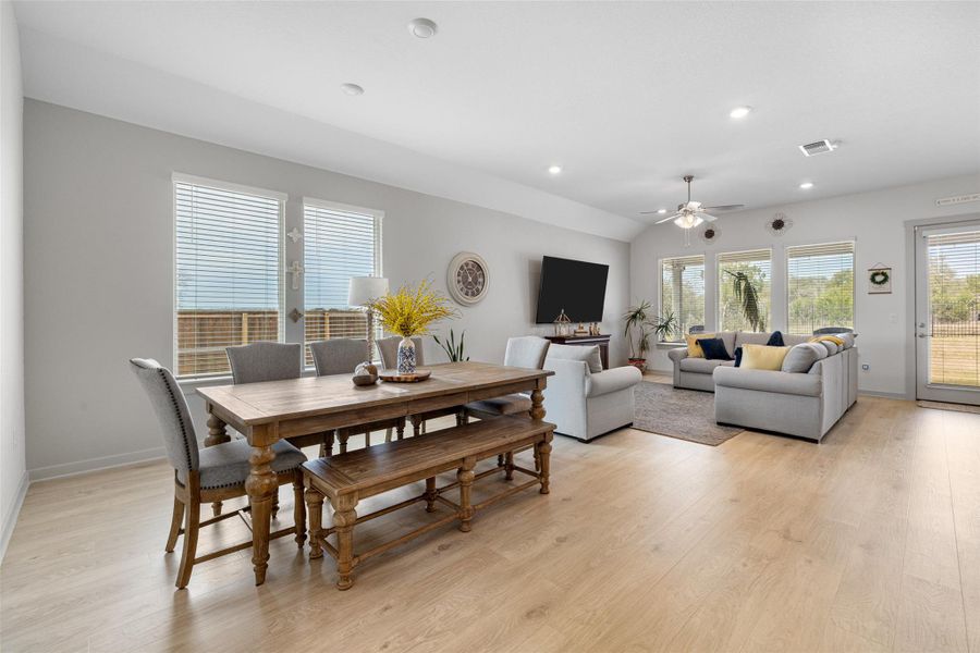 Dining space with light wood-type flooring, recessed lighting, and a ceiling fan Dining space with light wood-type flooring, recessed lighting, and a ceiling fan