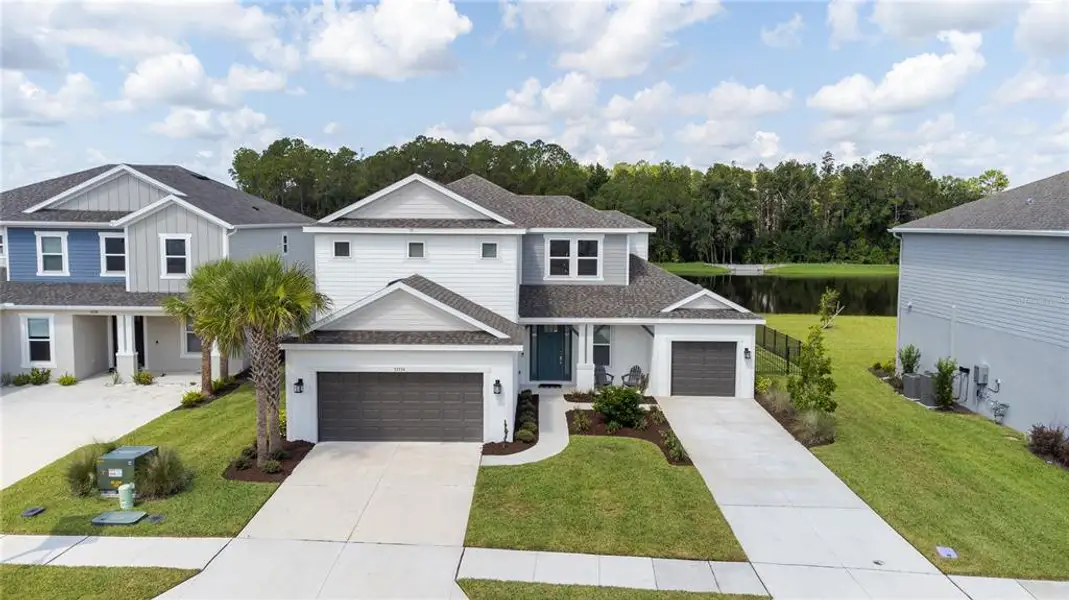 Front exterior of a new home in , Wesley Chapel, FL, highlighting curb appeal (Image 2).