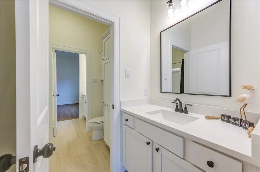 This pretty secondary bath offers modern elegance with its sleek fixtures, ample storage, and a bright, welcoming atmosphere perfect for relaxation. This pretty secondary bath offers modern elegance with its sleek fixtures, ample storage, and a bright, welcoming atmosphere perfect for relaxation.