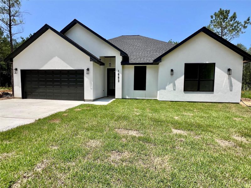 Front exterior of a new home in , Dayton, TX, highlighting curb appeal (Image 24).