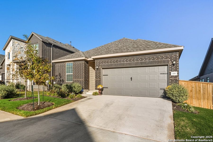 Front exterior of a new home in La Cima, San Marcos, TX, highlighting curb appeal (Image 1). Front exterior of a new home in La Cima, San Marcos, TX, highlighting curb appeal (Image 1).